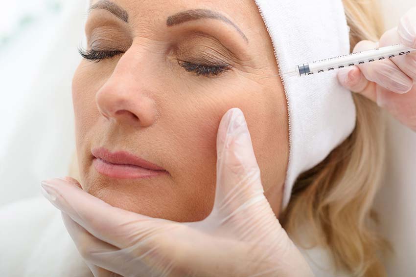 Older woman getting BOTOX® injections